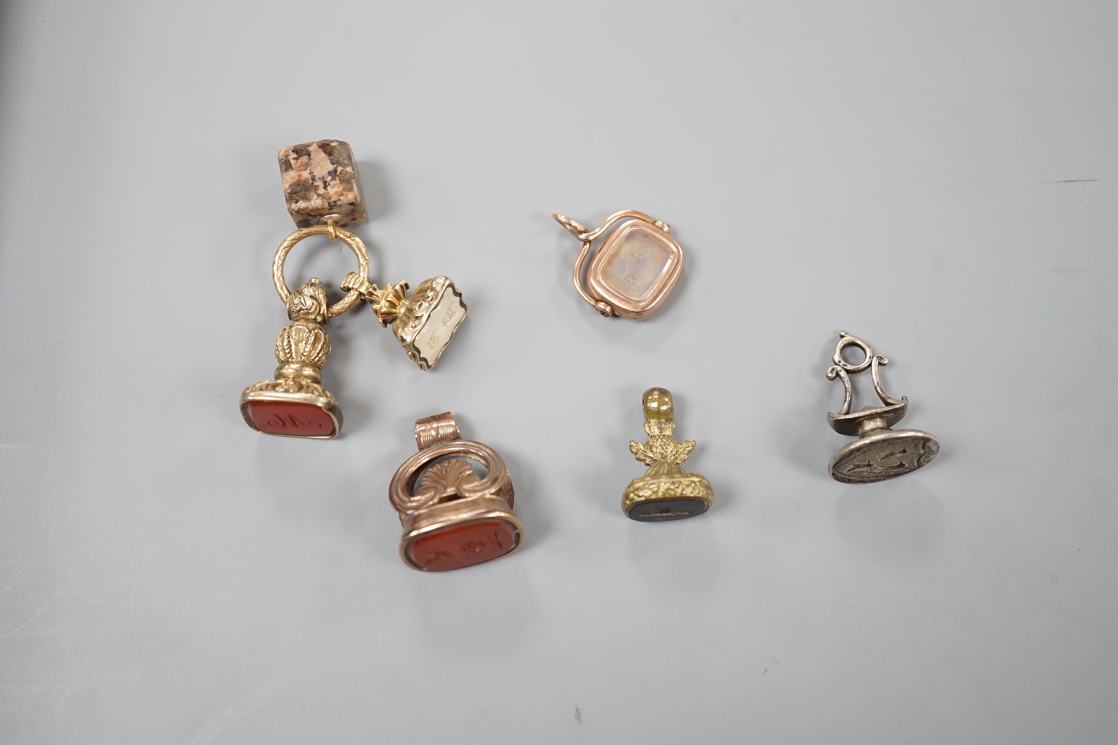 Six assorted Victorian and later mainly carnelian set fob seals including yellow metal overlaid and silver, largest 33mm.